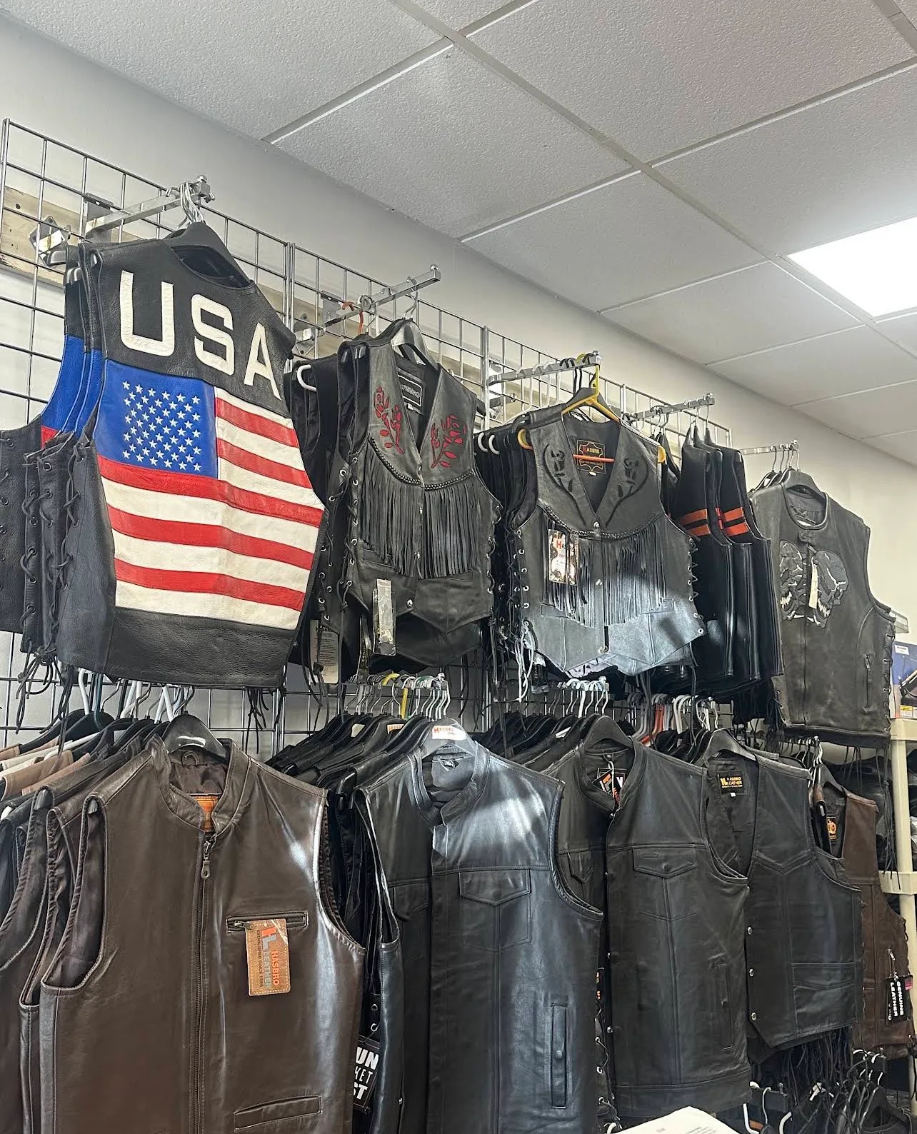 Leather motorcycle vests, including a USA flag vest